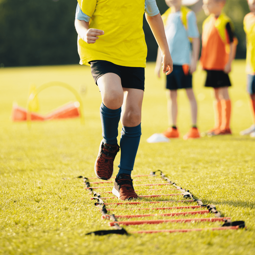 A group of young soccer players train together, highlighting the community-oriented aspect of fitness and sports.